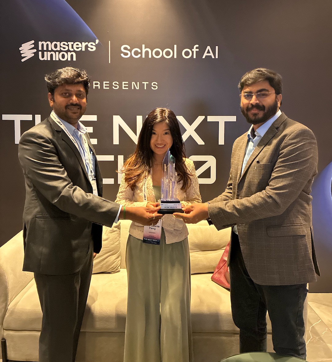 Nilam Insights team member holding the AI Paradigm Disruptor 2026 trophy